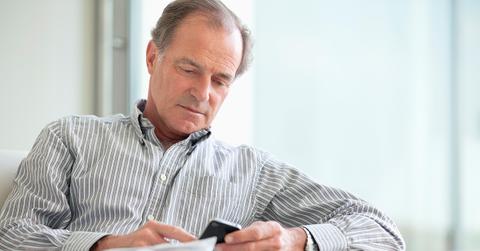 Man looking at his phone concerned.