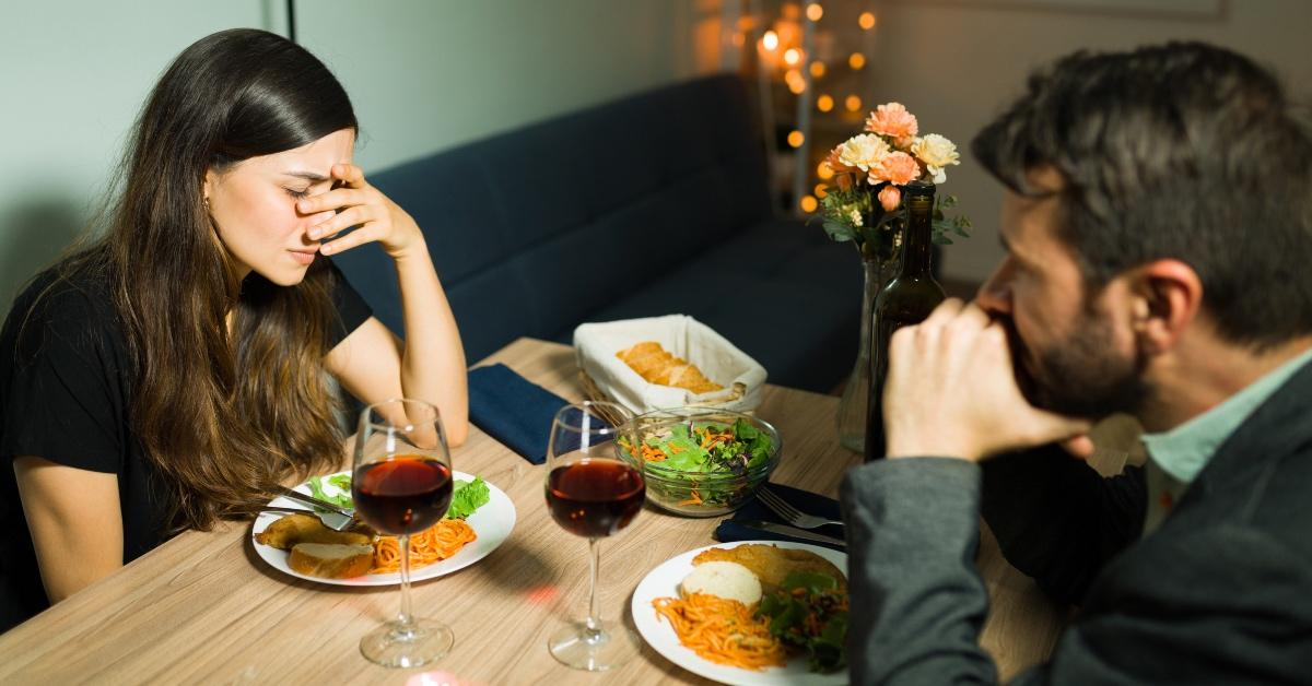 Husband and wife fight over dinner over mother's birthday reminder. - Stock Image