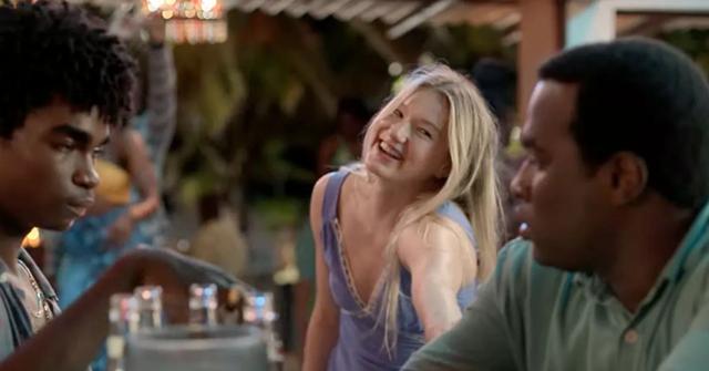Alison smiling at a bar with Clive and Edwin
