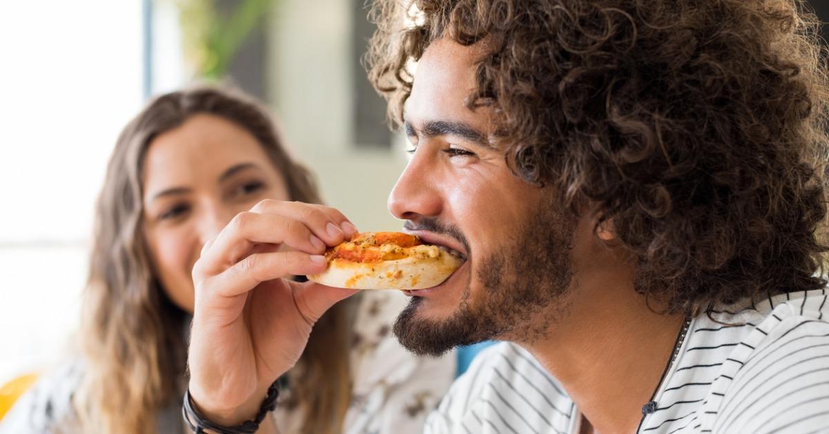 man eating pizza picture id