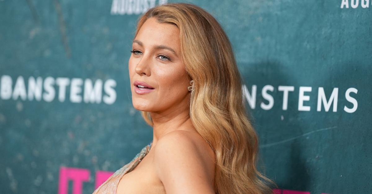 Blake Lively poses on a red carpet in August 2024.