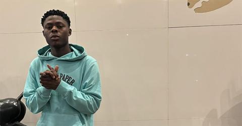 Mohbad wearing a green hoodie.