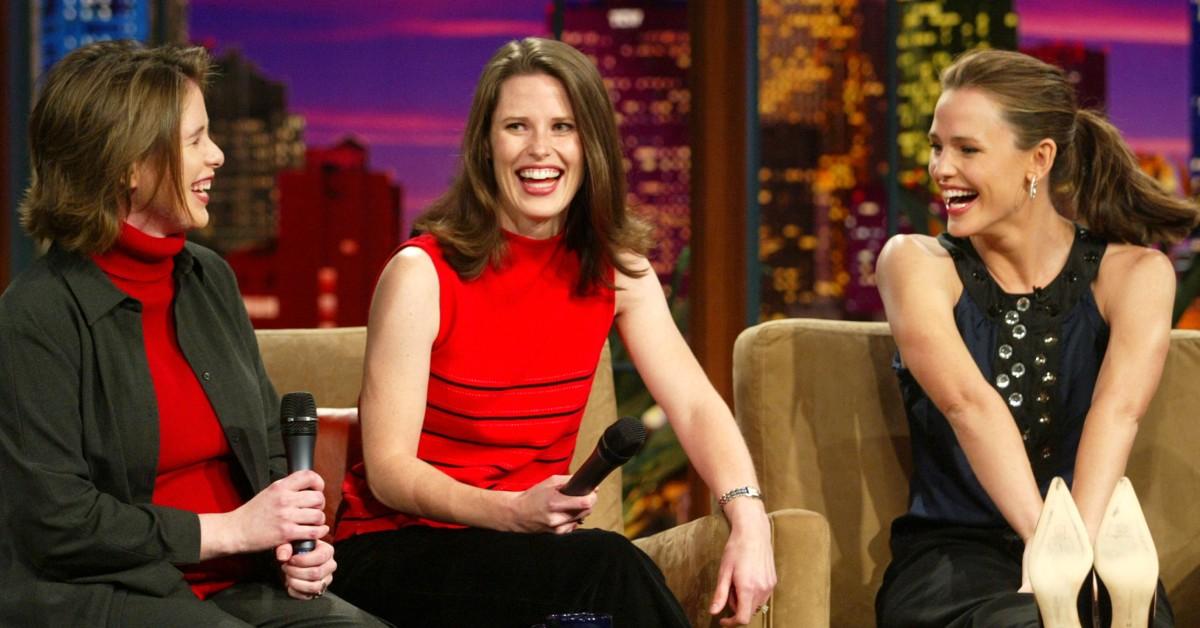 Jennifer Garner (R) laughs next to her sisters Susannah (L) and Melissa (center) on "The Tonight Show" in 2003