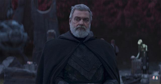 Baylan Skoll standing in a robe.