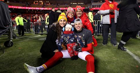 Harrison Butker on the field with his wife, son, and parents after AFC Championship Game at Arrowhead Stadium on Jan. 19, 2020