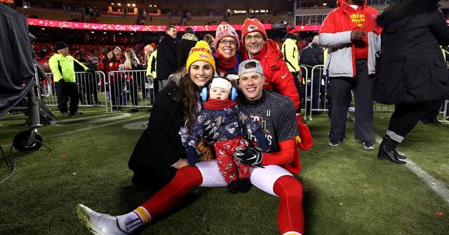 Harrison Butker on the field with his wife, son, and parents after AFC Championship Game at Arrowhead Stadium on Jan. 19, 2020