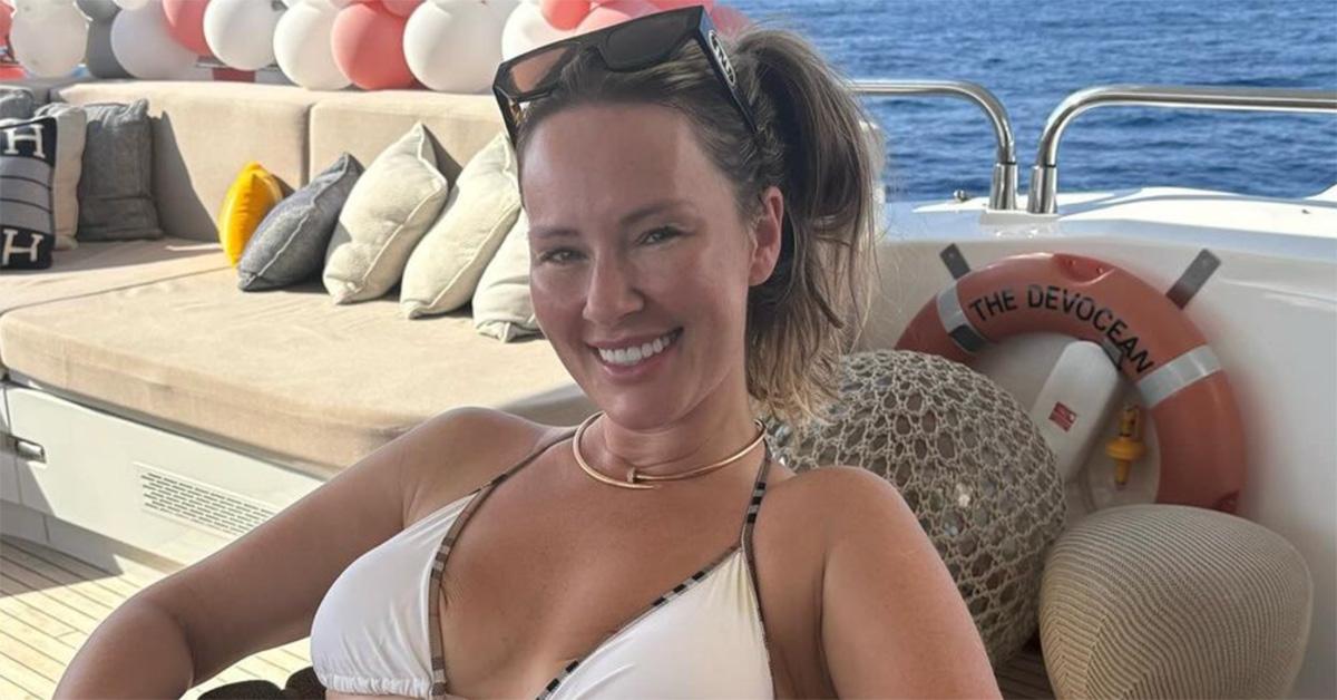 Dee Devlin on a boat in a bikini. 