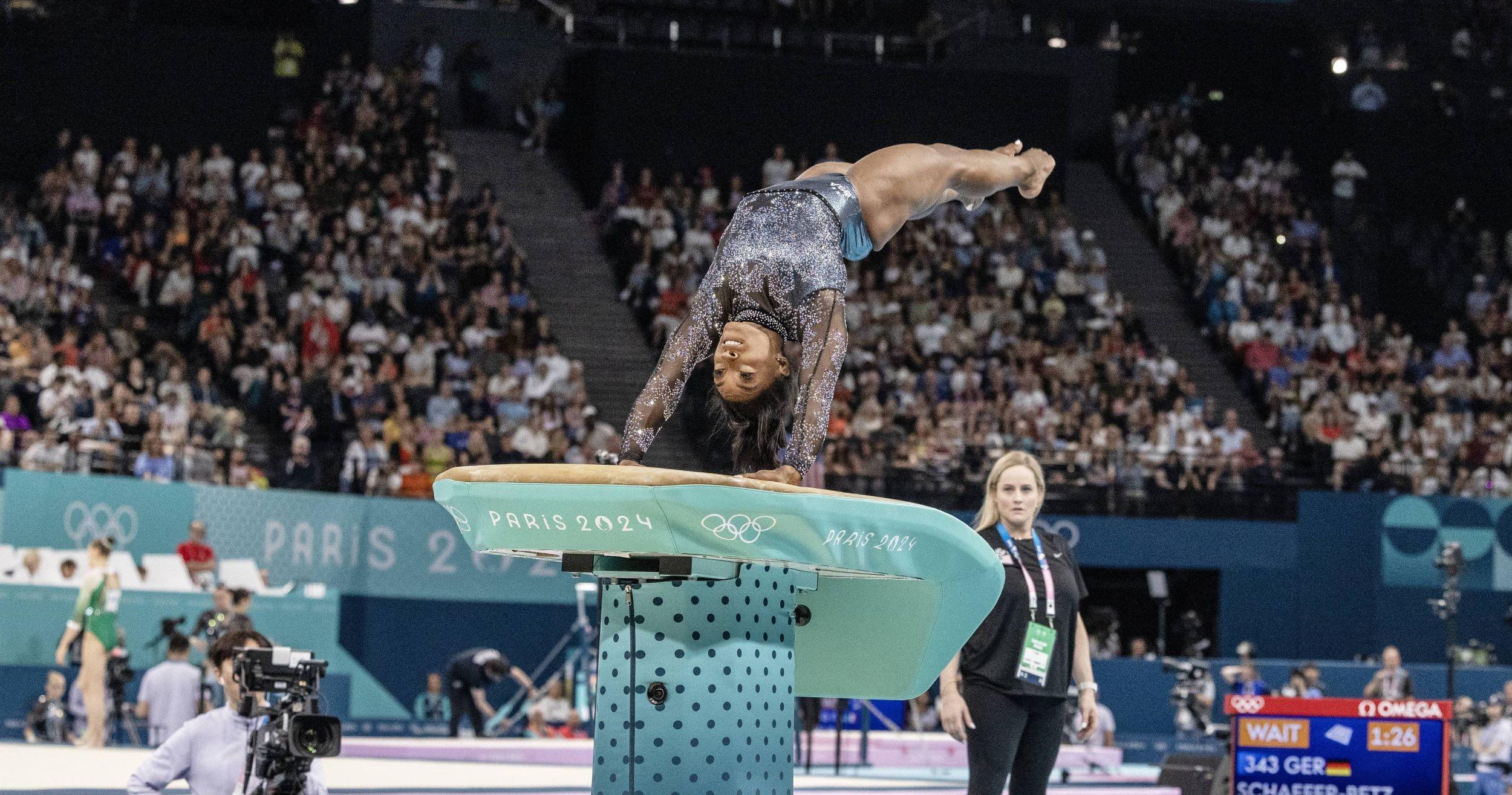 Simone Biles competing in the vault event at the 2024 Paris Olympics