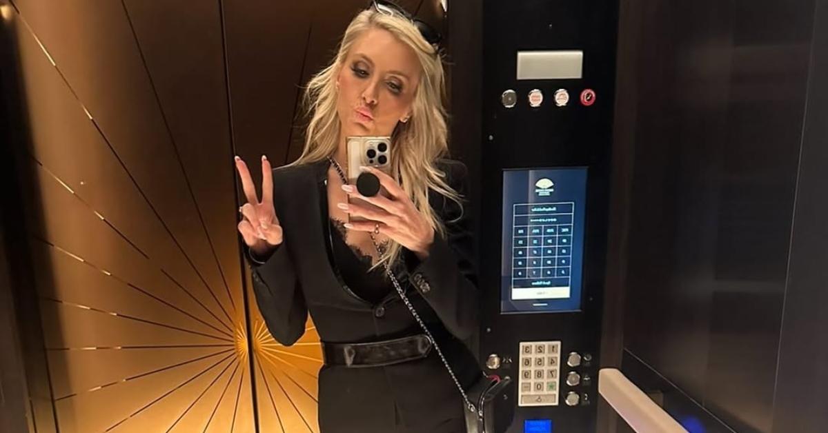 Taylor Middleton takes a mirror selfie in an elevator