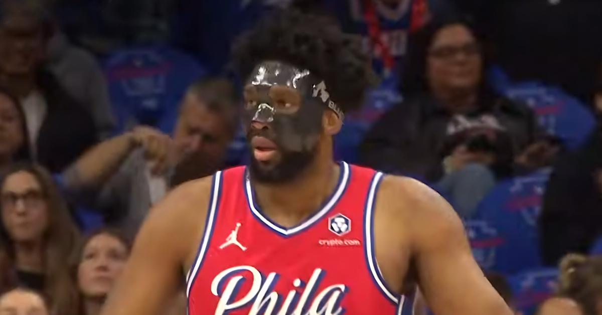 Joel Embiid wearing a mask during a 76ers game.