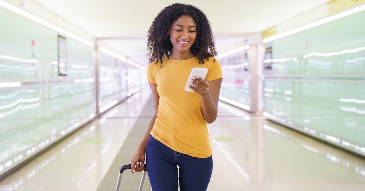 A woman at the airport on the phone