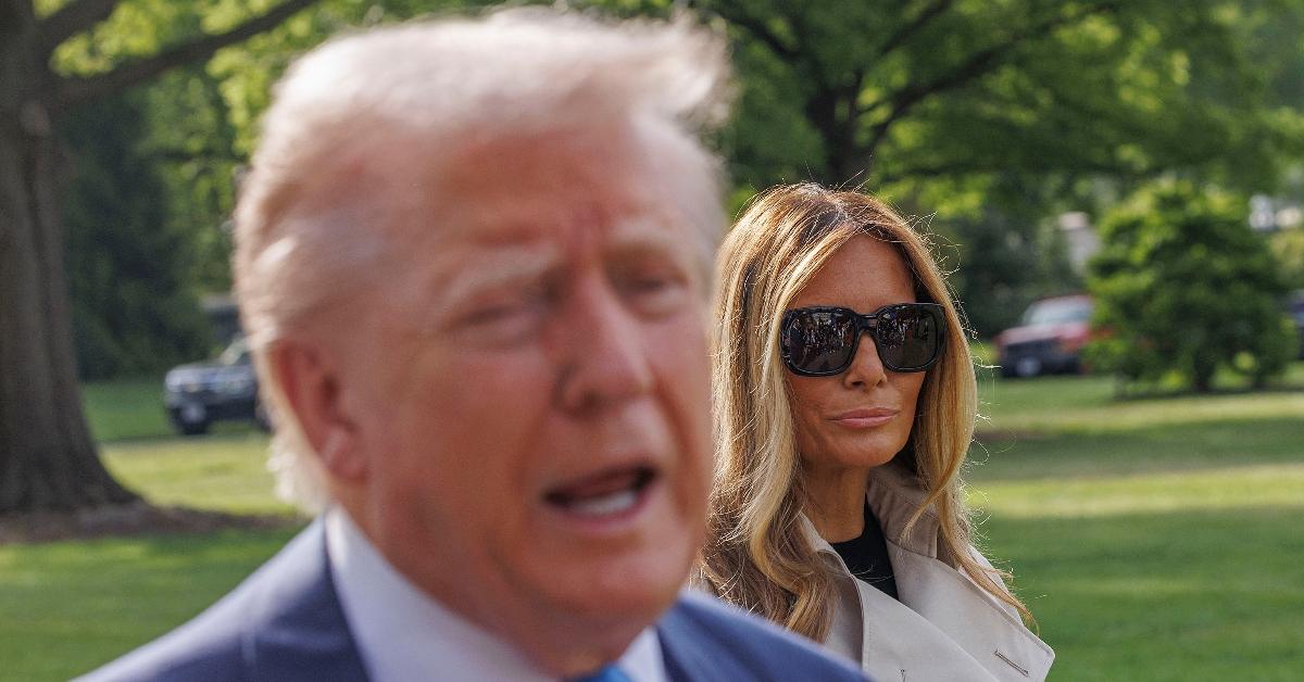 First Lady Melanie Trump (R) looks at President Donald Trump (L) as he is speaking
