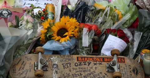 Fans left flowers honoring the life of Ozzy Osbourne in Birmingham, England.