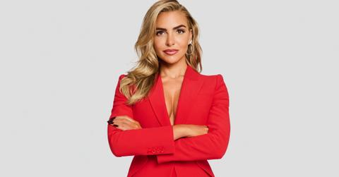 Eleonora Srugo in a red outfit with her arms folded