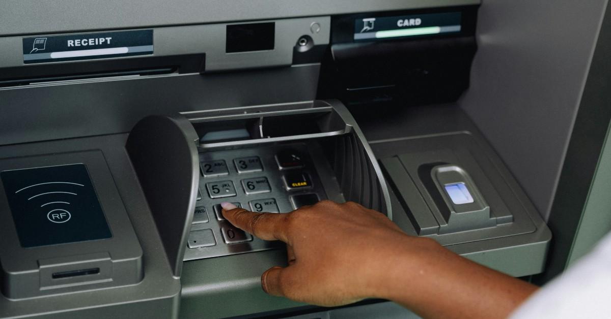 Someone using the ATM of a bank