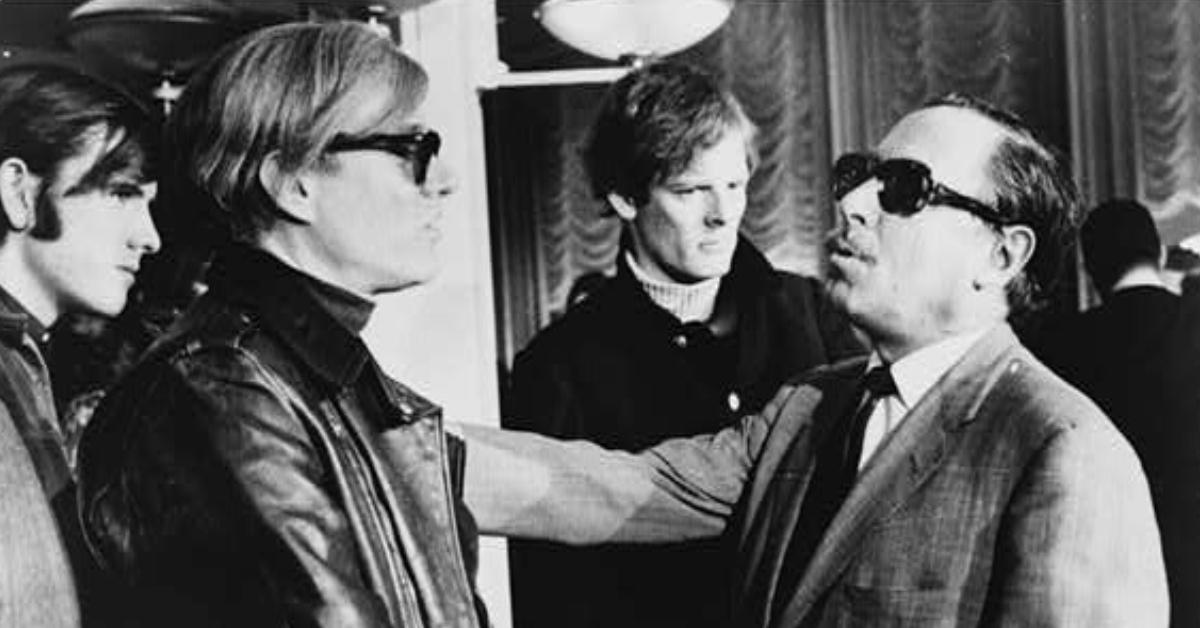 Andy Warhol (left) and Tennessee Williams (right) talking on the S.S. France, with Paul Morrissey in the background.