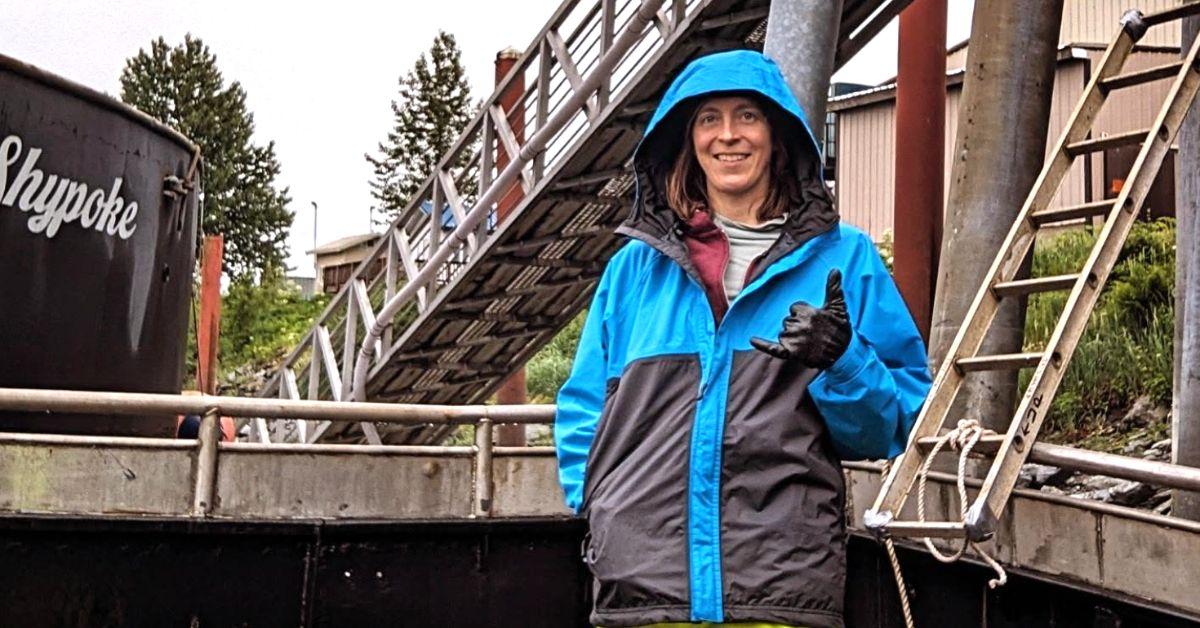 Sarah Danser in a jacket and gloves. 