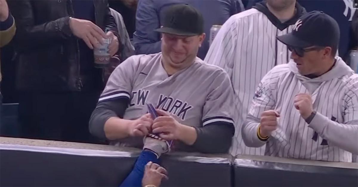 Fans interfering with a catch from Mookie Betts. 