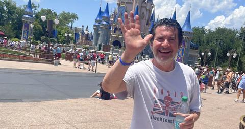 Elliot Segal waving while at Disney World.