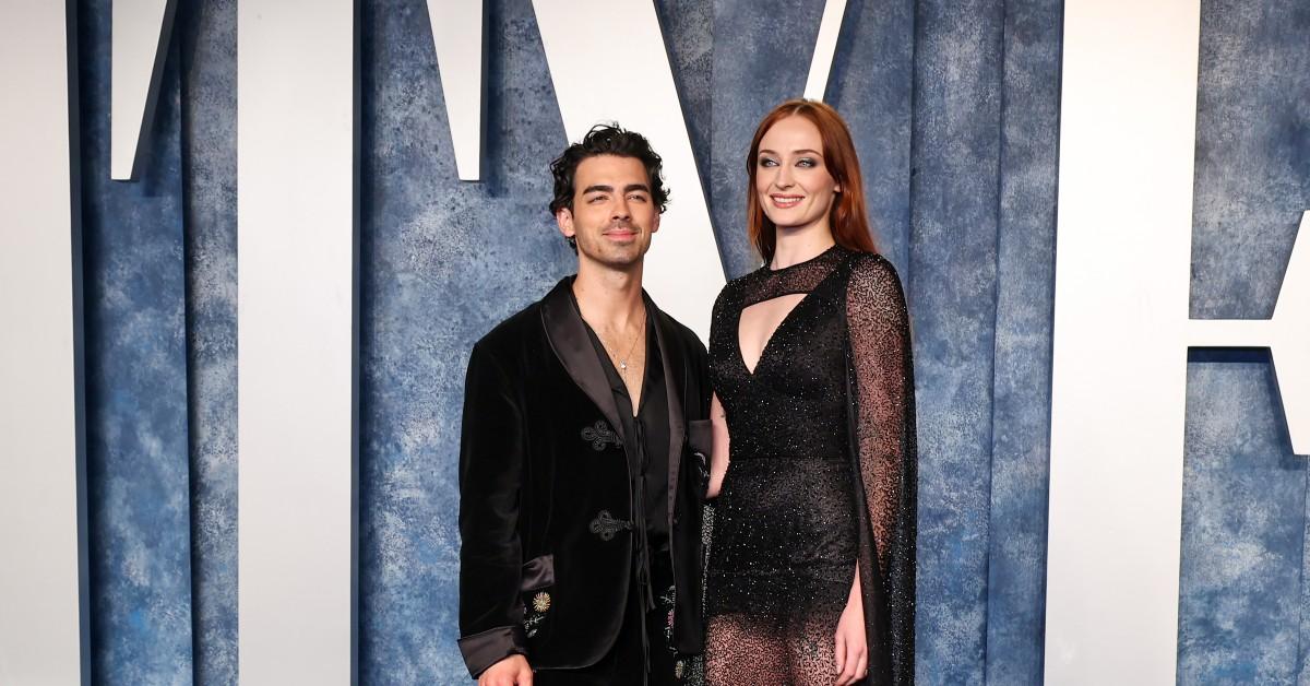 (L-R) Joe Jonas in a black suit, and Sophie Turner in a black dress, attend the  2023 Vanity Fair Oscar Party