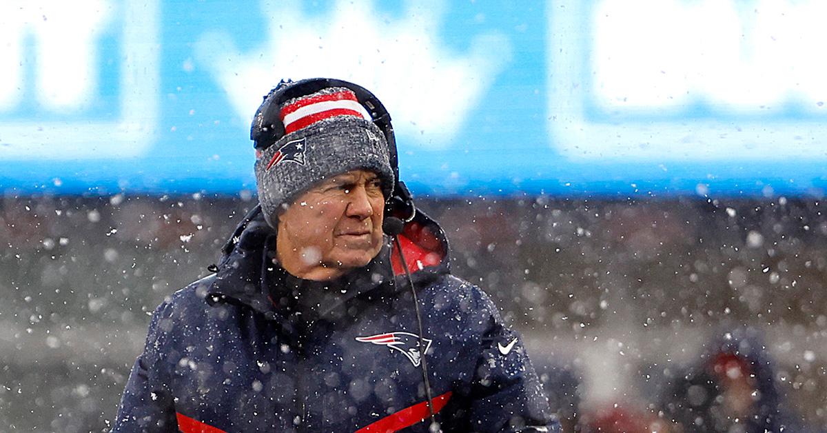 Bill Belichick in the snow during a game against the New York Jets. 