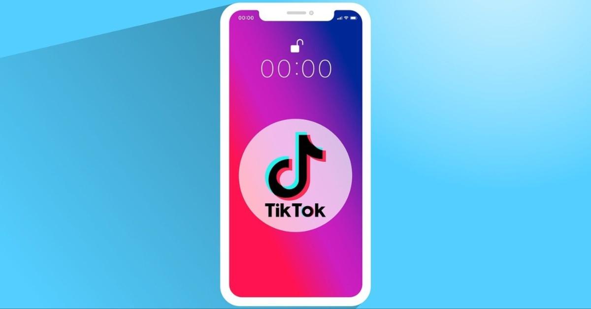 The TikTok logo is displayed on a mobile phone. 