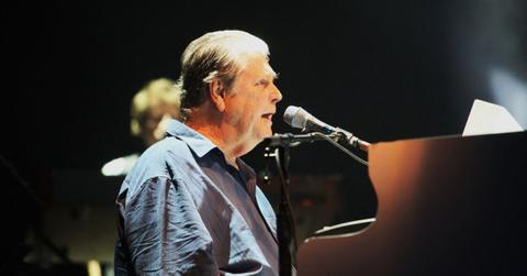 Brian Wilson performing on stage.