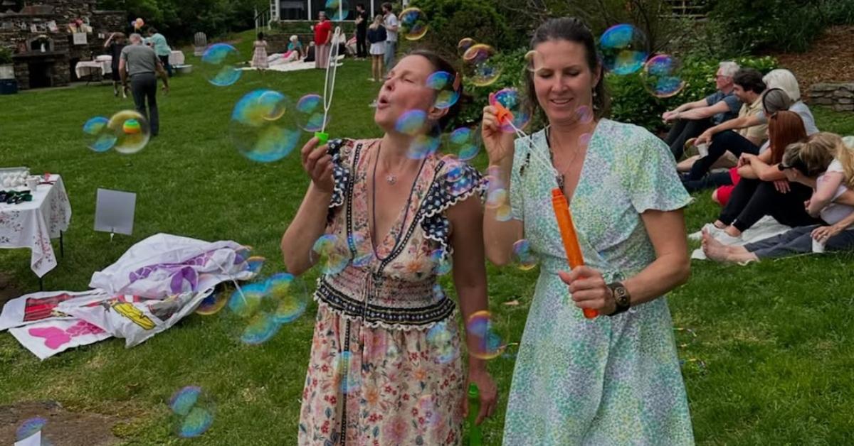 Ashley Judd blowing bubbles at one of her birthday parties.