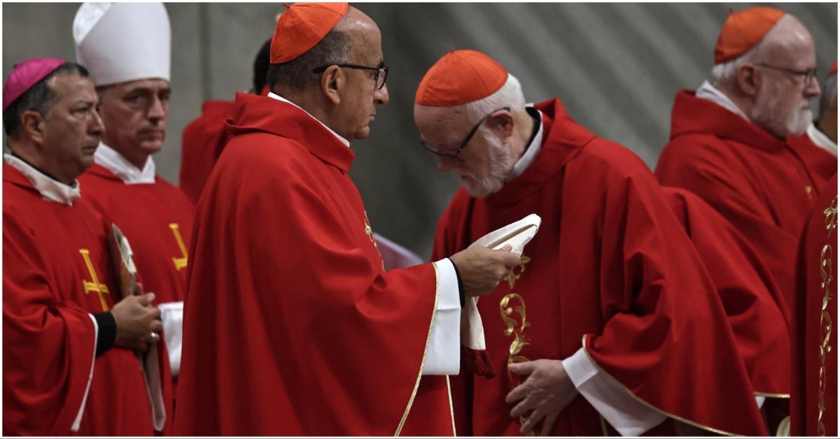 Cardinals wearing different hats
