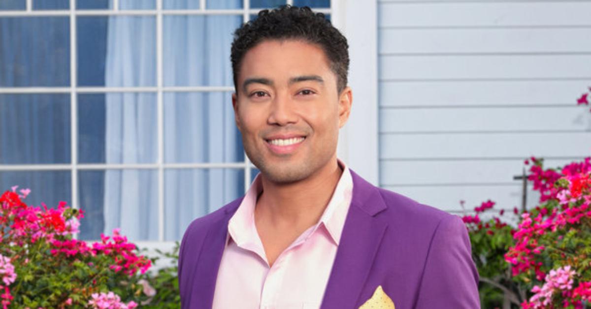 Jason Caperna smiles and poses in a purple suit for his official 'The Valley' Season 1 portrait.