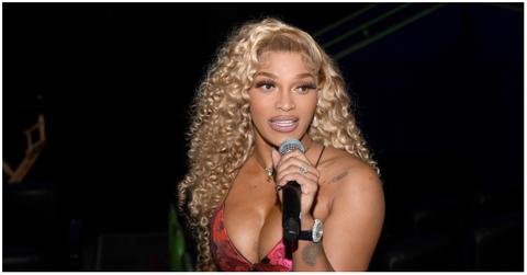 Joseline Hernandez talking into a microphone