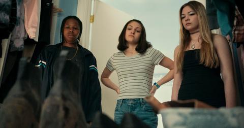 Dusty, Kelly, and Josephine stare at Reena's muddy shoes