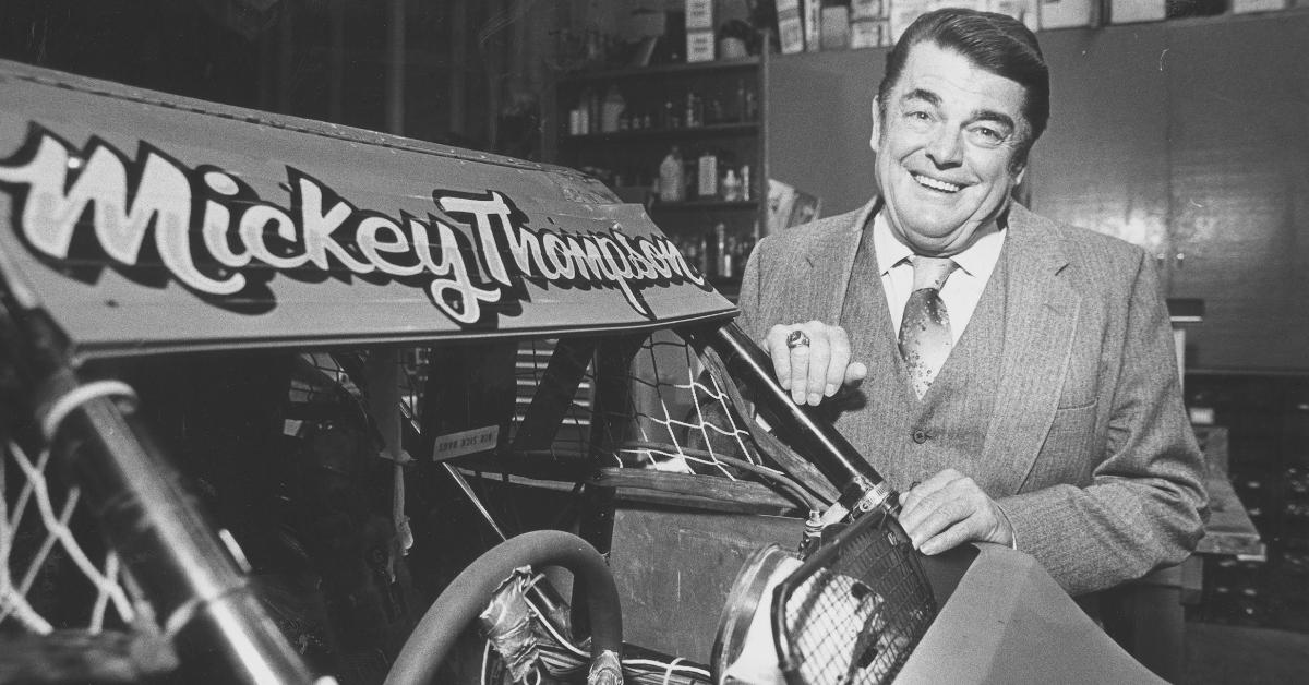 Mickey Thompson stands in his garage by a singleseat offroad racer in Sept. 1986