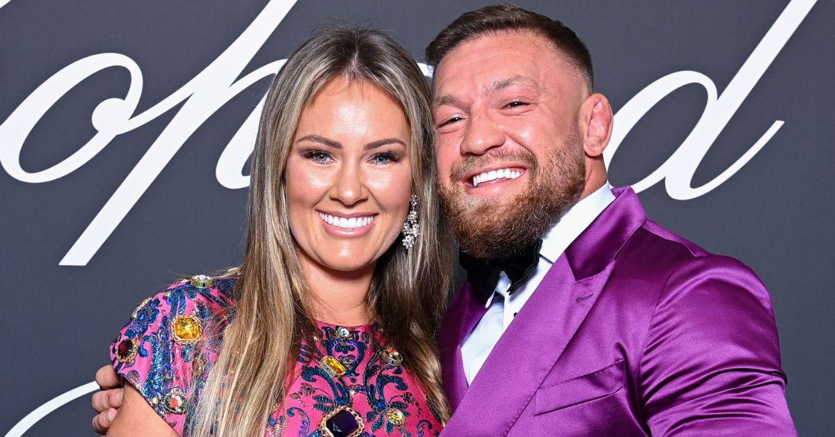 UFC champion Conor McGregor poses with long-term girlfriend Dee as he  returns home