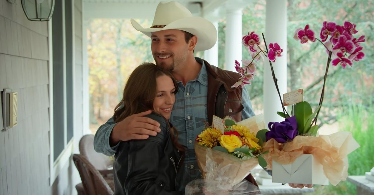 Mitchell and Sydney hug on her family's porch on Farmer Wants a Wife