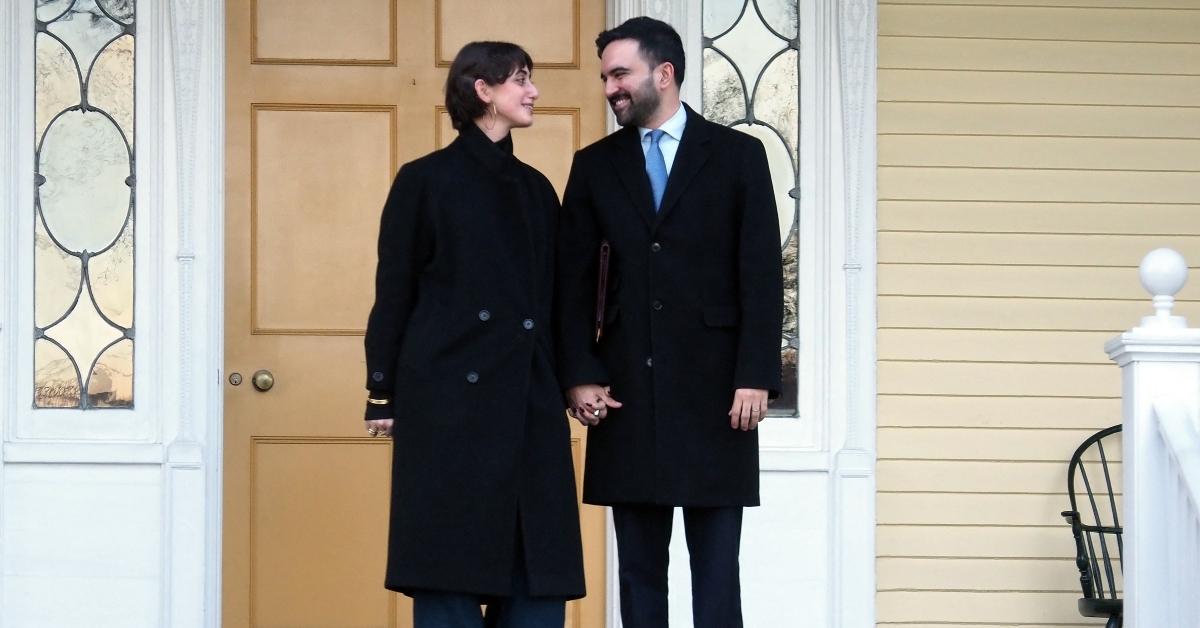 Mamdani and his wife stand on the porch of Gracie Mansion.
