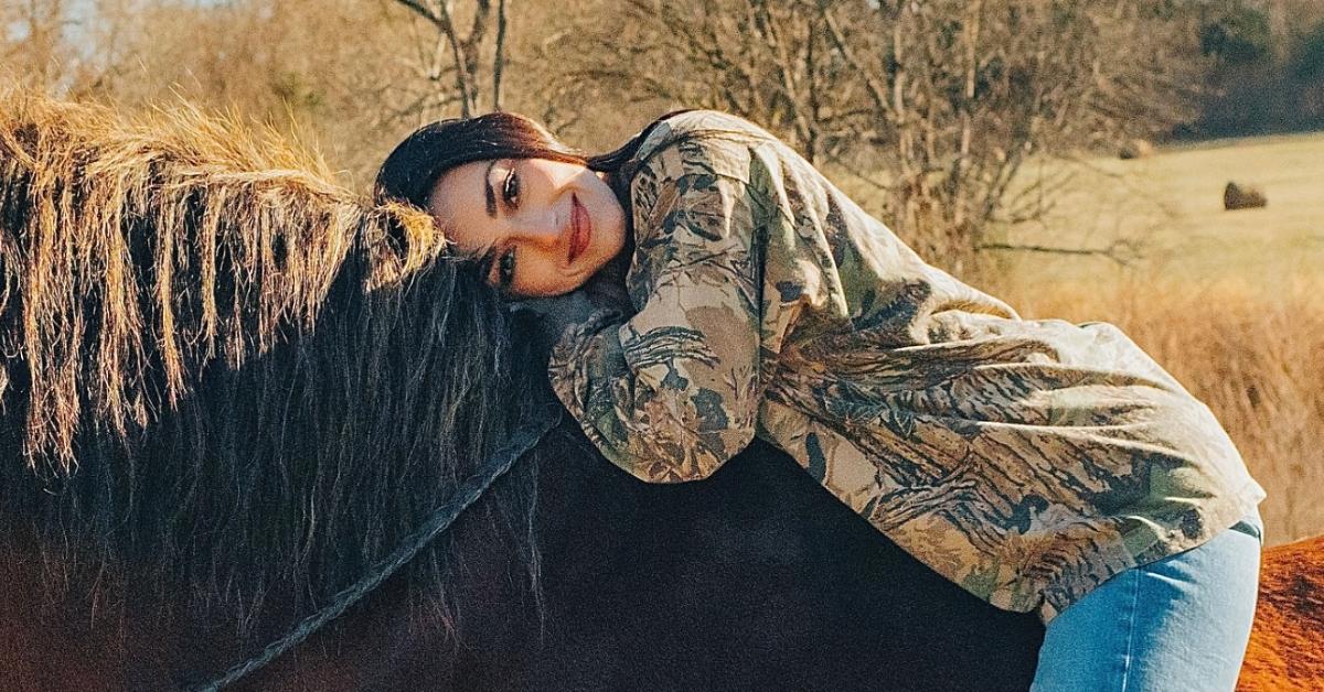 Alexis Wilkins on a horse