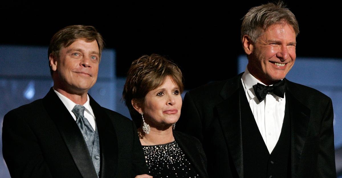 L-R: Mark Hamill, Carrie Fisher, and Harrison Ford at the AFI Awards in 2005.