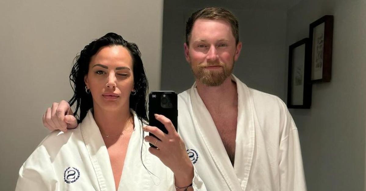 Kristen Doute and boyfriend Luke Broderick taking mirror selfie in hotel