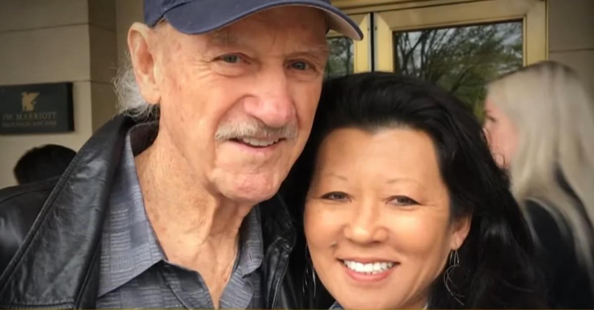 (l-r): Gene Hackman and Betsy Arakawa smiling outside