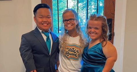 Alex and Anna Johnston and Allie Smith smiling