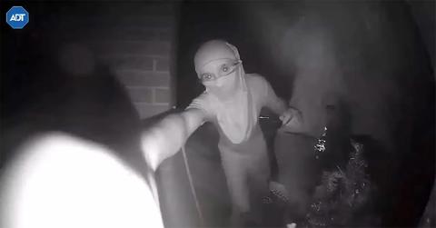 A teenager banging on a door as part of the door knock challenge on TikTok