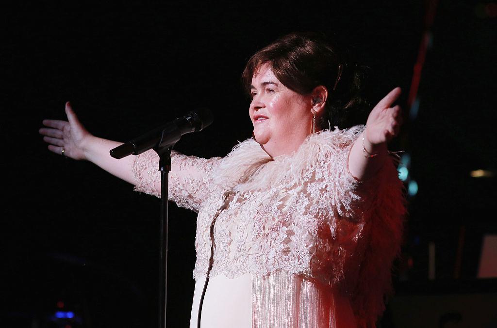 Susan Boyle live on stage during a performance.