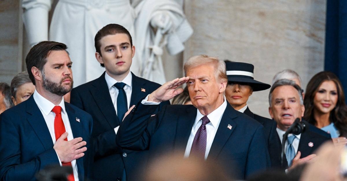 J.D. Vance and Barron look on as Trump salutes during his inauguration at the US Capitol