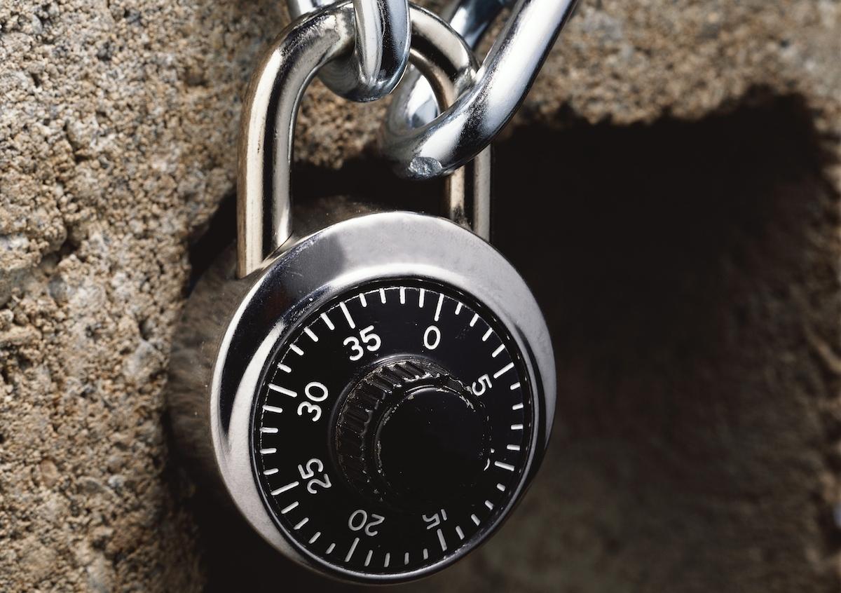 A combination lock on a metal chain