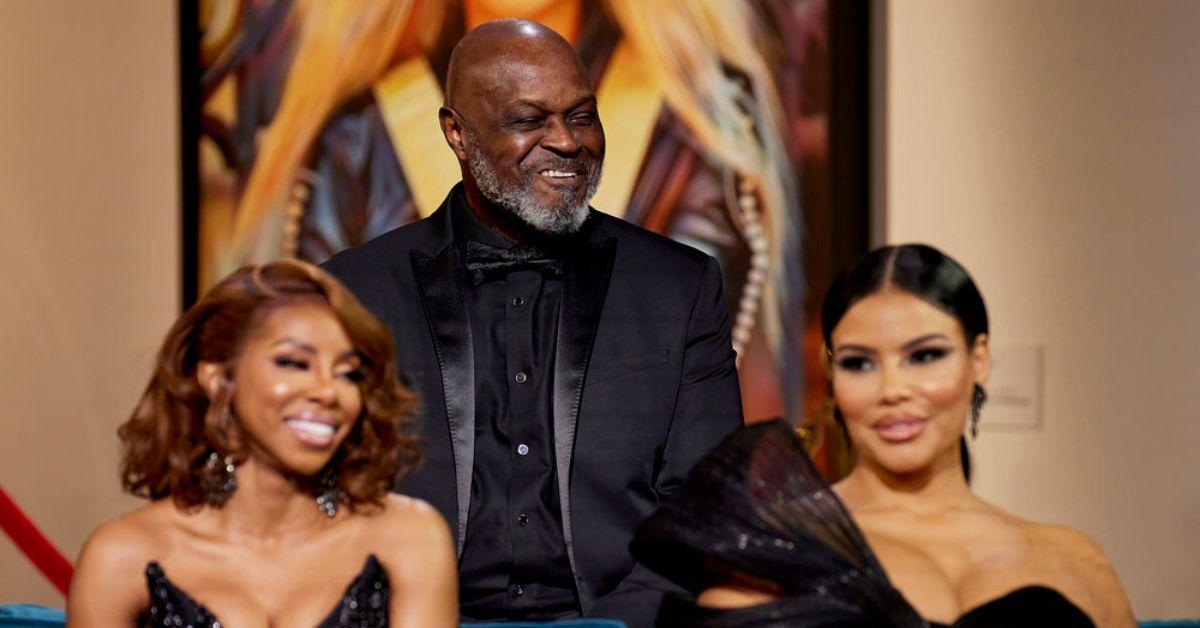 Candiace Dillard-Bassett and Mia Thornton sitting in front of Gordon Thornton, who is smiling