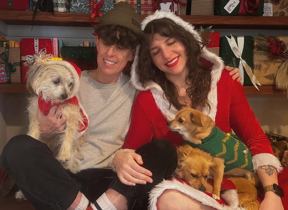 Andrea Gibson with their wife and three dogs