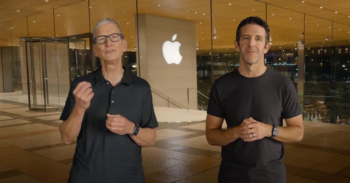 Tim Cook and John Ternus in front of an Apple logo.