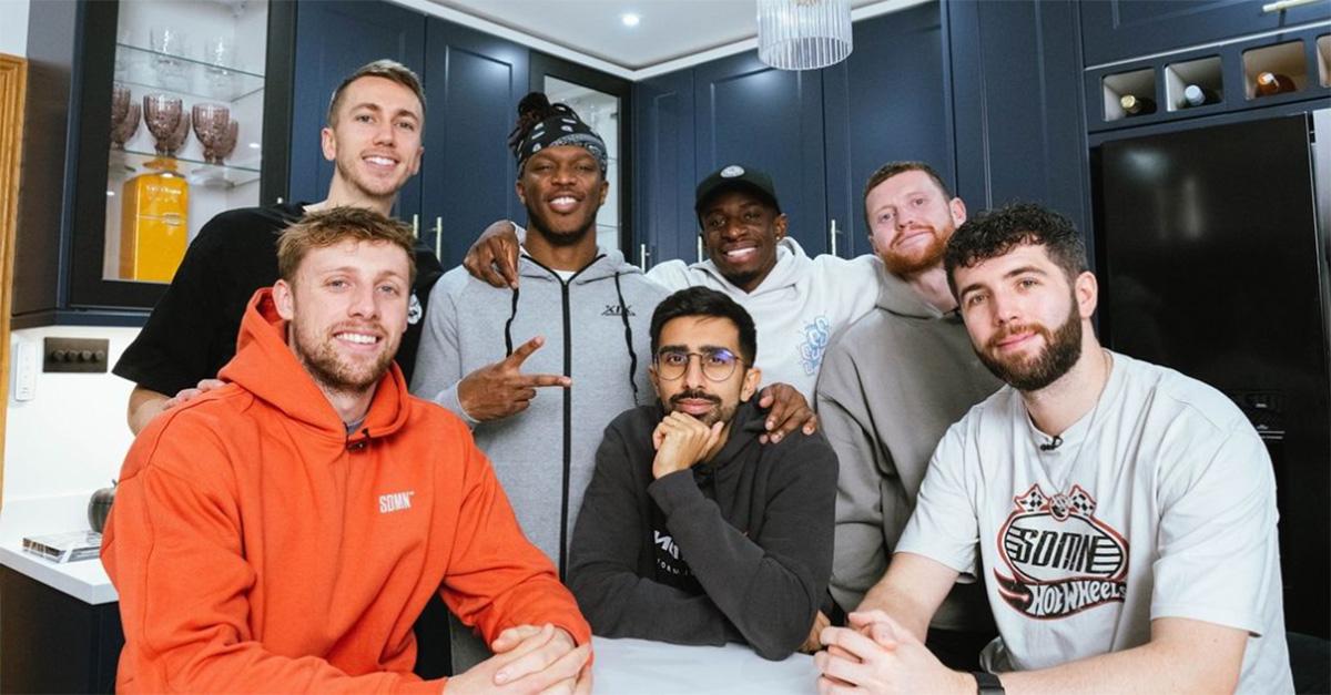 The Sidemen pose together in a kitchen for a Christmas photo. 