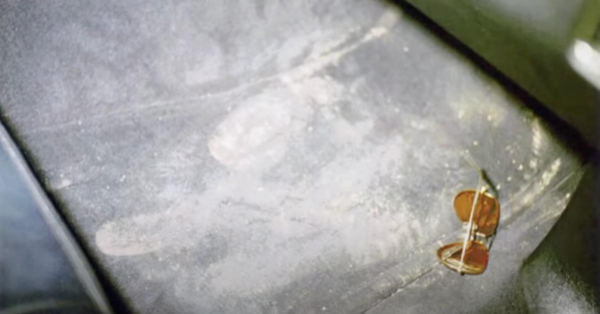 Muddy footprints and a pair onf sunglasses inside of Ron Rudin's abandoned car